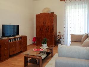a living room with a couch and a tv at Apartment Julka by Interhome in Kraj