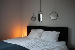 מיטה או מיטות בחדר ב-Stadsappartementen Harderwijk