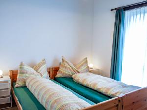Voodi või voodid majutusasutuse Holiday Home Ar Ronchée N- 9 by Interhome toas
