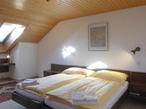 A bed or beds in a room at Apartment Eiger Residence Apt-A-425 by Interhome