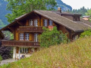 a wooden house on top of a hill at Apartment Drei Tannen by Interhome in Wengen