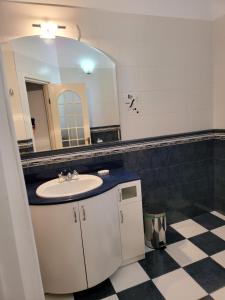 a bathroom with a sink and a mirror at Villa Favorita in Eforie Sud +141 photos