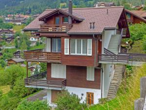 a house with balconies on the side of it at Apartment Melodie by Interhome in Wengen