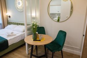 Posteľ alebo postele v izbe v ubytovaní Apartamenty u Kopernika by Rentoom