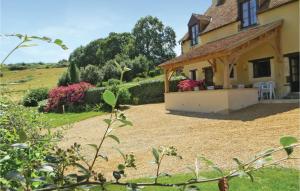 a view of a house with a gravel yard at Stunning Home In Domfront En Champagne in Domfront-en-Champagne