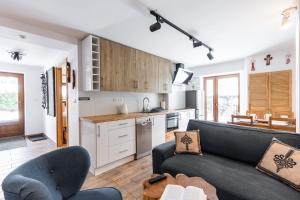 Kuchyňa alebo kuchynka v ubytovaní Apartamenty Na Wilcznik Zakopane