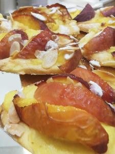 a close up of a pizza on a plate at La Mia casa di Campagna in Forlì +4 photos