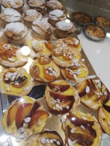 a bunch of donuts sitting on top of a table at La Mia casa di Campagna in Forlì