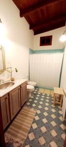 a bathroom with a toilet and a sink and a toilet istg at Apartamento en el vivero in Tilcara