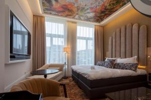 Postel nebo postele na pokoji v ubytování Boutique Hotel Jersey + 37 fotografií