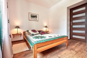Posteľ alebo postele v izbe v ubytovaní Apartamenty Na Wilcznik Zakopane