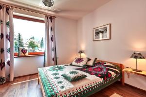 Posteľ alebo postele v izbe v ubytovaní Apartamenty Na Wilcznik Zakopane