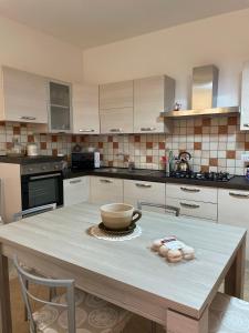 a kitchen with a table with a bowl on it at Casa Elena in Dorgali