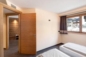 Posteľ alebo postele v izbe v ubytovaní Rasia Residence Relax Lake