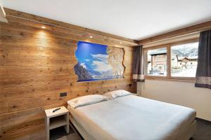 Posteľ alebo postele v izbe v ubytovaní Rasia Residence Relax Lake