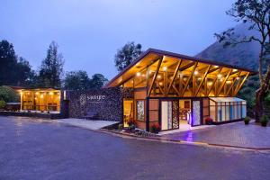 a large building with lights on the side of it at Savegre Hotel Natural Reserve & Spa in San Gerardo de Dota