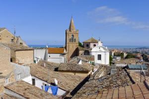 a view of a town with a church and roofs at B&B Ottocento in Spoltore