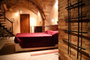 Un pat sau paturi într-o cameră la B&B Ottocento