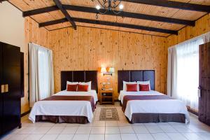 Ein Bett oder Betten in einem Zimmer der Unterkunft Hotel Savegre