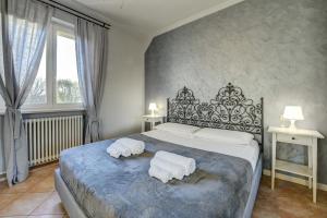 Posteľ alebo postele v izbe v ubytovaní Appartamento Margherita + 9 fotografií