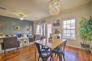 a dining room and living room with a table and chairs at Walk to Grand Lake Modern Afton Townhome! in Afton
