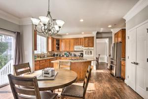 a kitchen with a table and a dining room at Laurel Family Home with Updates and Easy Location! in Laurel