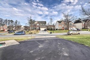 an empty street in a residential neighborhood with houses at Laurel Family Home with Updates and Easy Location! in Laurel
