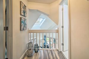 a staircase in a home with a white stair case at 5 Mi to Mashpee Commons Coastal Mashpee Condo in Mashpee