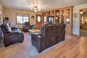 a living room with two leather chairs and a couch at Welcoming Cañon City Abode - Walk to River! in Canon City