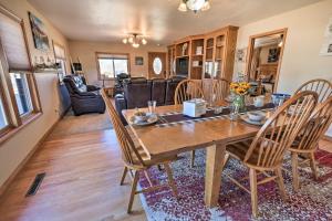 a dining room with a wooden table and chairs at Welcoming Cañon City Abode - Walk to River! in Canon City