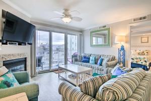 a living room with couches and a fireplace at Condo with Spacious Balcony - 1 Block to Beach! in Ocean City