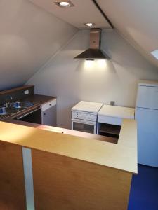a kitchen with a sink and a counter top at NUVOLA Summer Spring in Zottegem