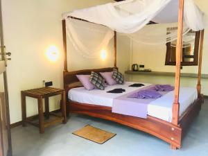 Letto o letti in una camera di Mango Tree House