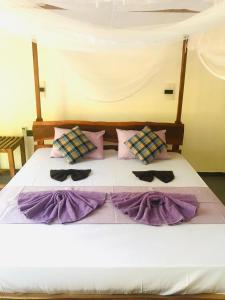 Letto o letti in una camera di Mango Tree House