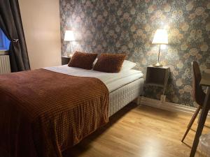 Postel nebo postele na pokoji v ubytování Hotell Humbla