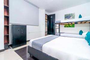 Krevet ili kreveti u jedinici u okviru objekta Hotel Bogota Home