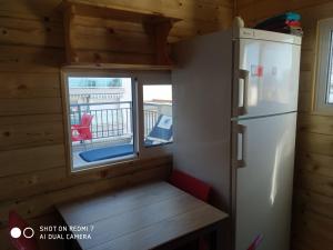 Kuchyň nebo kuchyňský kout v ubytování Habitacion Familiar en un Ático con gran terraza y,cocina ,en la playa