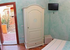 TV a/nebo společenská místnost v ubytování I Mari Di Gallura Suites and Rooms