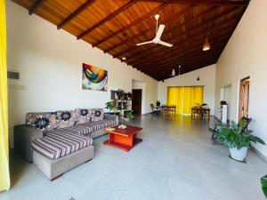 a living room with a couch and a table at Feel Home in Kandy