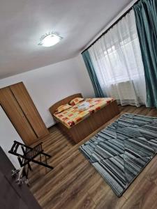 Posteľ alebo postele v izbe v ubytovaní Casa din 2 Mai
