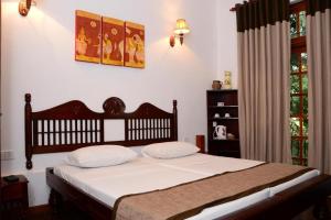 Letto o letti in una camera di Veraima Kandy