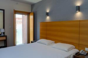 Katil atau katil-katil dalam bilik di Flag Hotel Barcelos