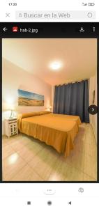 Una cama o camas en una habitación de COMODORO Magnífico apartamento en la playa