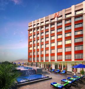 a rendering of a hotel with a pool and chairs at Welcomhotel By ITC Hotels, Guntur in Guntūr