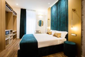Postel nebo postele na pokoji v ubytování Design Suite Cinque Terre La Spezia