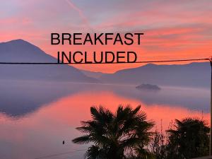 a sunset over a lake with the words breakfast included at BnB122 bed&breakfast in Ascona