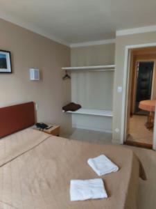 Cama o camas de una habitación en Hotel Pouso Real