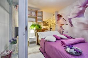 Posteľ alebo postele v izbe v ubytovaní Apartman u vili sa privatnim bazenom i privatnom wellness oazom