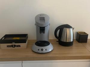 a blender sitting on a counter next to a box at Vivez La vue mer - Studio - Port de plaisance - Plage in Le Havre