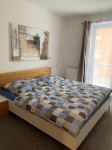 Postel nebo postele na pokoji v ubytování Apartmán Jestřáb Janské Lázně
